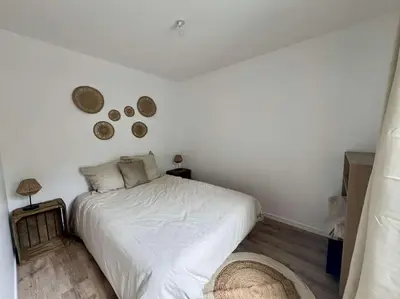 Un ou plusieurs lits dans un hébergement de l'établissement Maison 2 pièces Ouistreham