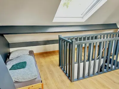 Un ou plusieurs lits dans un hébergement de l'établissement La Casita, triplex avec jardin proche du centre