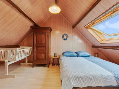 Un ou plusieurs lits dans un hébergement de l'établissement Holiday Home Les pieds dans l'eau by Interhome