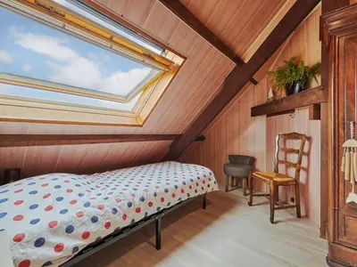Un ou plusieurs lits dans un hébergement de l'établissement Holiday Home Les pieds dans l'eau by Interhome