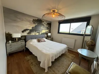 Un ou plusieurs lits dans un hébergement de l'établissement Les Palmiers