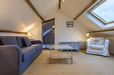 Coin salon dans l'établissement Normandie ferme restaurée du 18ème avec jacuzzi