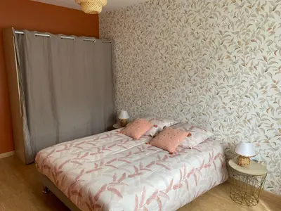 Un ou plusieurs lits dans un hébergement de l'établissement Le gîte du bonheur