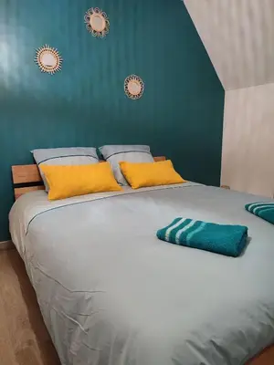 Un ou plusieurs lits dans un hébergement de l'établissement Gîte Bienvenue chez Naty