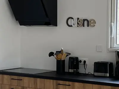 Cuisine ou kitchenette dans l'établissement Le Petit Chemin