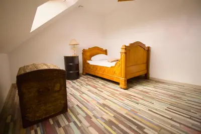 Un ou plusieurs lits dans un hébergement de l'établissement Evasion entre Mer et Campagne avec Babyfoot et terrain de pétanque, 3 chambres, cheminée - Intendance Luxury Host