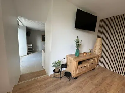 Télévision ou salle de divertissement dans l'établissement Gîte de campagne