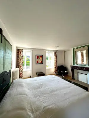Un ou plusieurs lits dans un hébergement de l'établissement Chambre d'hôtes de charme Partager Enregistrer
