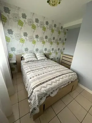 Un ou plusieurs lits dans un hébergement de l'établissement Appartement RDC avec terrasse