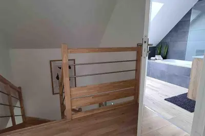 Un ou plusieurs lits dans un hébergement de l'établissement Charmante maison raffinée, conviviale & familiale