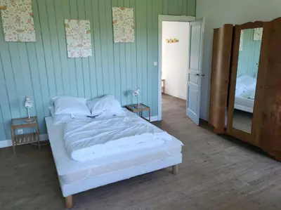 Un ou plusieurs lits dans un hébergement de l'établissement Charmante maison