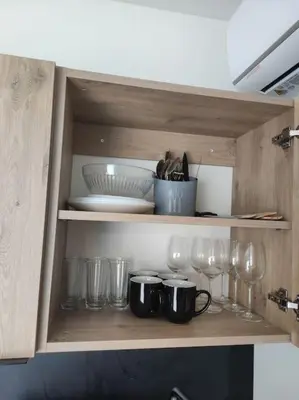 Cuisine ou kitchenette dans l'établissement Logement proche Caen et plages