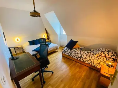 Un ou plusieurs lits dans un hébergement de l'établissement Escale à Balbec- Proche plage et Centre ville Cabourg