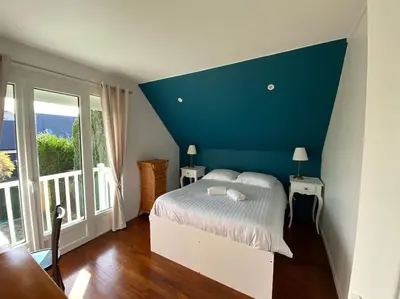 Un ou plusieurs lits dans un hébergement de l'établissement Villa Mirabelle - Proche plage