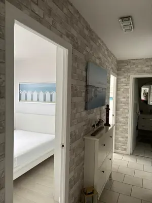 Un ou plusieurs lits dans un hébergement de l'établissement Belle vue - Vue panoramique sur la Mer
