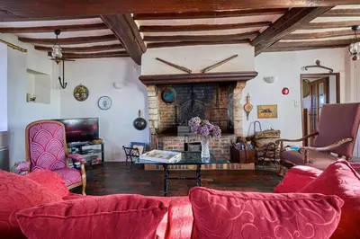 Coin salon dans l'établissement La Ferme de la Chapelle Saint-Roch - Maison de 190 m2