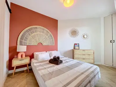 Un ou plusieurs lits dans un hébergement de l'établissement Appartement bohémien à Cabourg