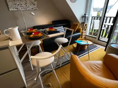 Coin salon dans l'établissement Les Mimosas -Joli appartement tout confort