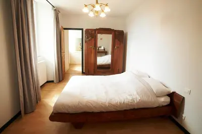 Un ou plusieurs lits dans un hébergement de l'établissement Chambre Du Coq à la Ferme de Franqueville