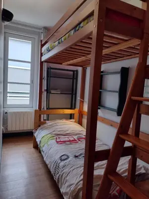 Un ou plusieurs lits dans un hébergement de l'établissement Petit appartement - Quartier Vaugueux Château
