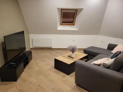 Télévision ou salle de divertissement dans l'établissement Appartement