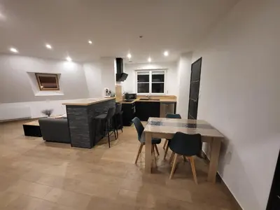 Coin salon dans l'établissement Appartement