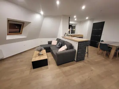 Coin salon dans l'établissement Appartement