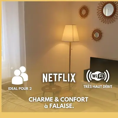 Télévision ou salle de divertissement dans l'établissement Charme et confort dans le centre-ville de Falaise quartier calme - Larès