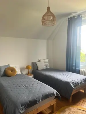 Un ou plusieurs lits dans un hébergement de l'établissement Maison Cosy Bord de Mer