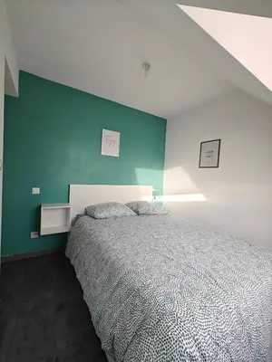 Un ou plusieurs lits dans un hébergement de l'établissement Maison 6 chambres avec piscine proche Cabourg