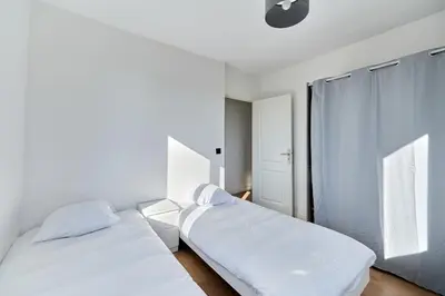 Un ou plusieurs lits dans un hébergement de l'établissement Appartement Sérénité Normande - Welkeys