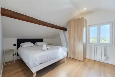 Un ou plusieurs lits dans un hébergement de l'établissement Appartement Lumière Normande - Welkeys