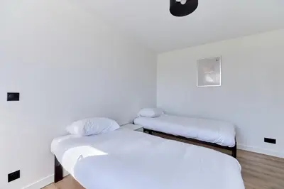 Un ou plusieurs lits dans un hébergement de l'établissement Appartement Évasion Normande - Welkeys