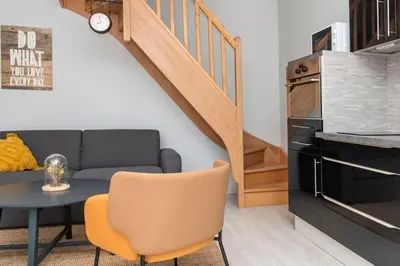 Coin salon dans l'établissement Beau duplex, proche zénith et palais des sports