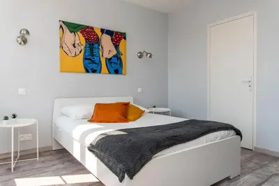 Un ou plusieurs lits dans un hébergement de l'établissement Beau duplex, proche zénith et palais des sports