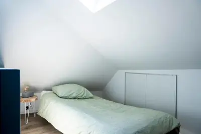 Un ou plusieurs lits dans un hébergement de l'établissement Triplex de qualité, quartier calme