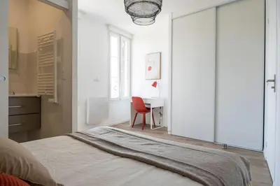 Un ou plusieurs lits dans un hébergement de l'établissement Triplex de qualité, quartier calme