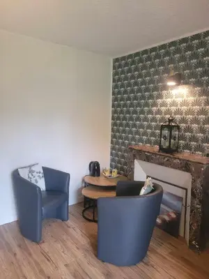 Coin salon dans l'établissement Château de la Rucquetière