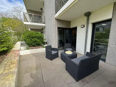 Coin salon dans l'établissement Appartement spacieux avec terrasse