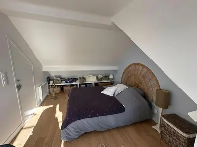 Un ou plusieurs lits dans un hébergement de l'établissement Charmante maison Cabourgeaise