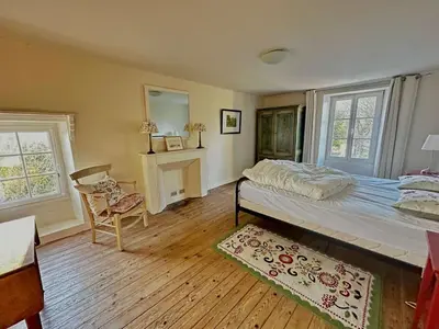 Un ou plusieurs lits dans un hébergement de l'établissement La maison du jardinier