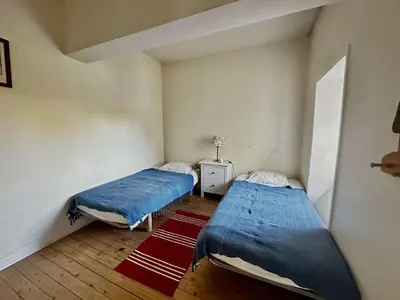 Un ou plusieurs lits dans un hébergement de l'établissement La maison du jardinier