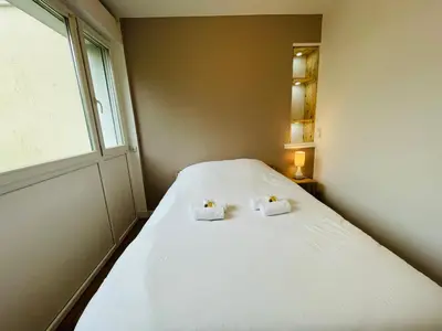 Un ou plusieurs lits dans un hébergement de l'établissement Wolk, Joli appt une chambre