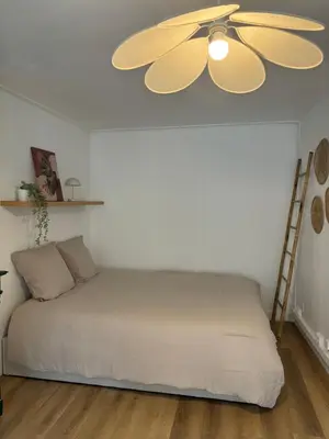 Un ou plusieurs lits dans un hébergement de l'établissement Appartement terrasse au cœur de la ville