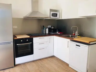Cuisine ou kitchenette dans l'établissement Jacuzzi & Sauna privatifs - Vue mer
