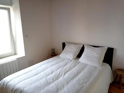 Un ou plusieurs lits dans un hébergement de l'établissement Gîte rénové à Ravenoville