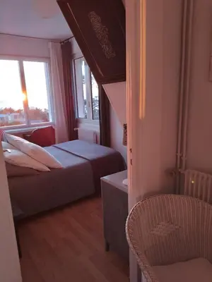 Un ou plusieurs lits dans un hébergement de l'établissement Chambres d'hôtes Christa