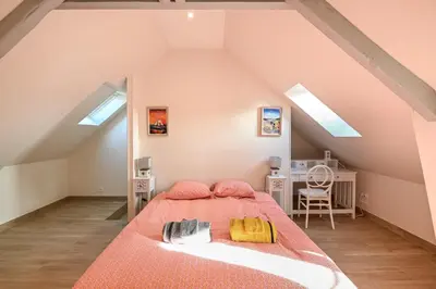 Un ou plusieurs lits dans un hébergement de l'établissement La Maison des Ours - proche plage de Courseulles