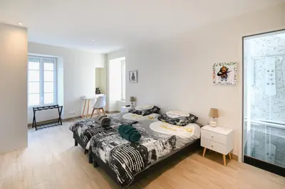 Un ou plusieurs lits dans un hébergement de l'établissement La Maison des Ours - proche plage de Courseulles