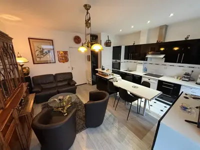 Coin salon dans l'établissement Appartement